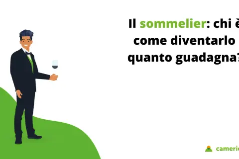 Un uomo elegante con un bicchiere di vino in mano, che illustra chi è il sommelier, come diventarlo e quanto guadagna.