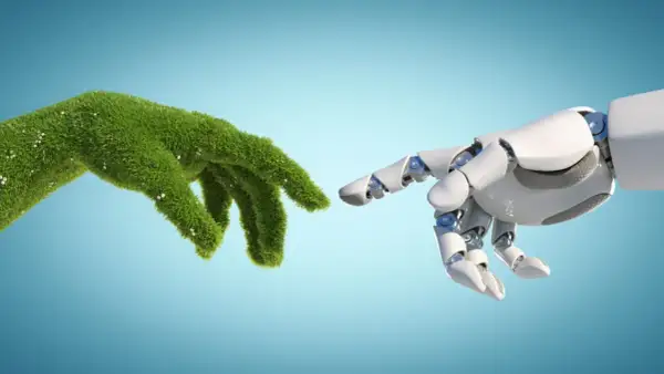 Mano verde e mano robotica si sfiorano, simboleggiando il futuro dell'ingegneria ambientale e i suoi sbocchi lavorativi.